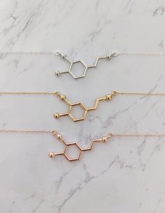 Dopamine Molecule Necklace I use the most gorgeous high-quality sparkly sterling silver chain which makes this necklace as one reviewer says "absolutely stunning." Keep this in mind when comparing similar products. Dopamine is a neurotransmitter in the brain that plays a crucial role in regulating mood, motivation, and pleasure. It is often referred to as the "feel-good" neurotransmitter because it is associated with feelings of reward and pleasure when released in the brain. Imbalances in dopam Dopamine Necklace, Mood Motivation, Dopamine Molecule, Brain Necklace, Chemistry Necklace, Biology Jewelry, Molecule Necklace, Happy Jewelry, Necklace Extender