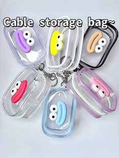 five different colored eyes are in the same zipper bag, and one has a keychain