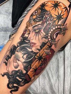 a woman's arm with tattoos on it