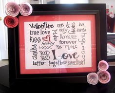 a framed valentine's day card with rolled flowers and paper roses in front of it