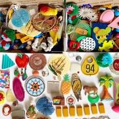 two boxes filled with assorted items on top of a table