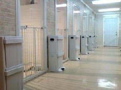 a row of white urinals sitting next to each other in a room with brick walls