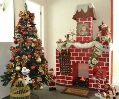 a decorated christmas tree sitting in front of a red brick fireplace with decorations on it