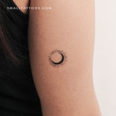 a woman with a small tattoo on her arm