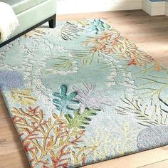 an area rug with various colors and designs on it