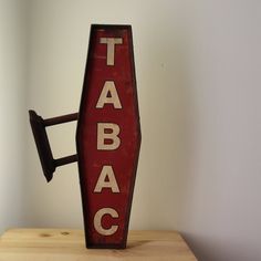 Sign tabac wall hanging French tabac store sign Tobacco sign Paris Smoker gift Smoker sign Garage decor Loft design Bar decor Wall decor Pub VINTAGE STYLE tobacco wall decor. Rust aspect metal frame. Two hooks to fix on the wall. Dimensions: Height 23.6" / 60.5 cm Width 11" / 28 cm Depth 1.9" / 5.2 cm Vintage Store Signs, Store Sign, Design Bar, Pub Signs, Loft Design, Garage Design, Store Signs, Vintage Store, Bar Signs