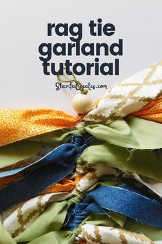 a pile of scarves with text overlay reading rag tie garland diy tutor