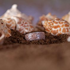 A beach lover's dream, the She Sells Seashells ring combines moonstone and rose gold hues in a mesmerizing DualTone design. Delicately etched with seashells, sand dollars, and starfish, this ring captures the essence of sun-soaked shores and timeless ocean treasures. Product Dimensions:width: 6.6mmthickness: 1.75mm | Enso Rings Etched Coastal Silicone Ring | She Sells Seashells - Moonstone/Rose Gold | Size 5 Enso Rings, Sea Rings, Beach Rings, Santa List, Fashion Girly, Ocean Treasures, Sand Dollars, She Sells Seashells, Silicone Ring