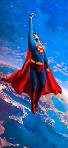 superman flying over the earth with his arms in the air