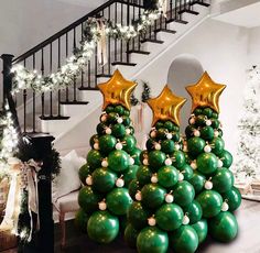 christmas tree made out of balloons in front of stairs