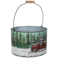 an old fashioned red truck with trees painted on it's side is hanging from a metal bucket