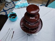 a chocolate cake sitting on top of a white table