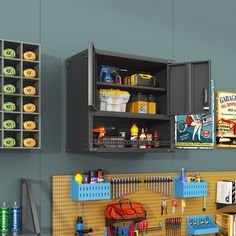 there is a garage with tools on the wall and in the cabinet next to it