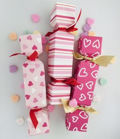 several pink and white boxes with hearts on them