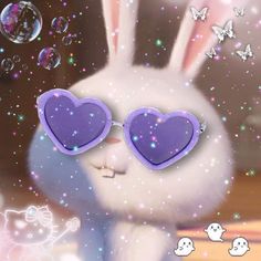 a rabbit with heart shaped sunglasses in front of bubbles