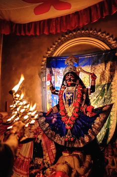 an idol is displayed in front of a mirror