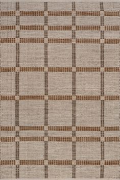 a brown and white rug with squares on it