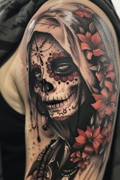 a woman's half - sleeved tattoo with flowers and skulls on her arm