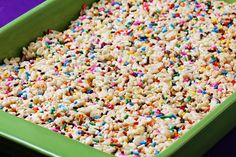 sprinkled rice in a green casserole dish with colorful sprinkles