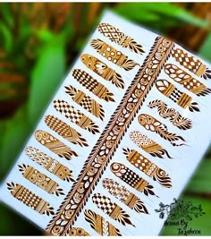 an intricately designed sticker on the side of a white box with gold designs