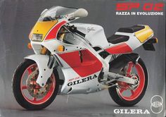 a red, white and yellow motorcycle sitting on top of a gray background with the words'spa d'italia'in italian