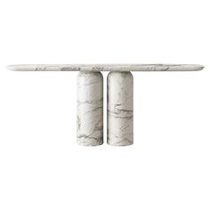 two white marble pedestals on top of each other