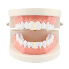 PRICES MAY VARY. Made from fine brass metal and plated with 14K gold which doesn’t easily fade. High quality brass is used as base metal to keep our grillz durable and not easy to broke. One size fit most: It will fit 99% of the people with our adjustable silicon molding bars. EVEN if you have chipped or crooked teeth! This means that it fits any mouth size regardless of the shape of your mouth. Teeth grillz can be used on any Occasional such as Party, Rave Parties, Discos, Clubs, Halloween, Bir Gap Grillz, Gold Teeth Grills, Teeth Caps, Crooked Teeth, Gold Grillz, Grills Teeth, Teeth Jewelry, Dental Crowns, Gold Teeth