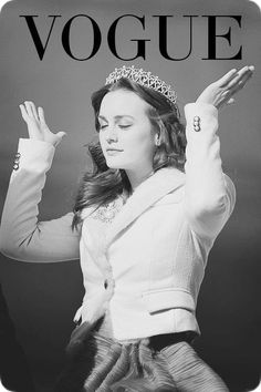 a black and white photo of a woman wearing a tiara with her hands in the air