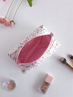 "This cute and floral makeup bag will help you in many ways. You can put your makeup in this toiletry bag when you are at a party or out. You can make a loved one happy by gifting it to a friend. If you are going to travel, you can put your cosmetic bag in your suitcase and prevent your make-up materials from being messy.You can use it as a pencil case when going to school.🌸 🧺Materials: Cotton fabric is used in the outer and inner fabric. There is a fiber fabric between the two, so we have a f Pindaya, High School Essentials, Sewing Makeup Bag, Handmade Makeup Bag, Pouch Ideas, Floral Makeup Bag, Toiletry Bag Women, Handmade Makeup, Floral Makeup