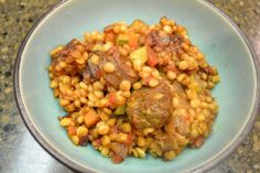 a bowl filled with food on top of a table