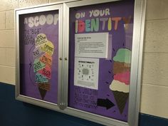 two bulletin boards with ice cream on them in a school hallway, one is purple and the other is white