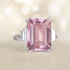 a pink tourmaline ring with three baguettes