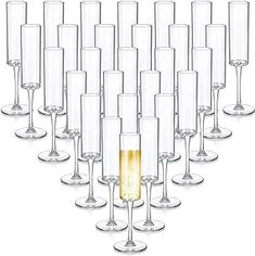 a group of wine glasses with champagne in them on a white background, all lined up and ready to be filled