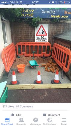 there are construction barriers around the yard area for children to play in and do something