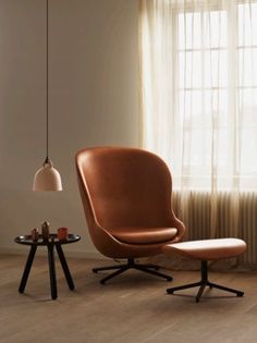 a chair and table in front of a window