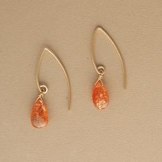 A blaze of shimmering sunstone carries warmth and brightness. 14k gold fill, elongated ear wires smooth sunstone briolettes Flame Earrings, Sunstone Earrings, Ear Wires, Gold Filled, Hoop Earrings, Gold, Design