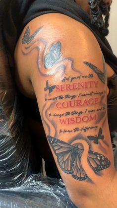 a man with a tattoo on his arm that says serenity, courage and wisdom