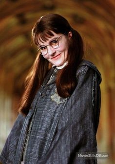 a woman in harry potter costume posing for the camera