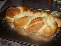 a loaf of bread sitting on top of a metal pan