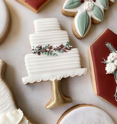 decorated cookies and pastries sitting on top of a table