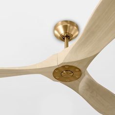 a ceiling fan with wooden blades and a light fixture on the top part of it