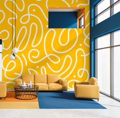 a living room with yellow walls and blue carpeted flooring, two couches in front of a large painting on the wall