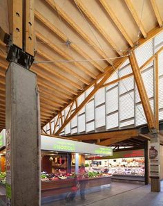 the inside of a grocery store with lots of produce