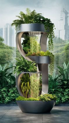 a tall metal planter filled with lots of plants