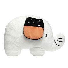 a white stuffed elephant with an orange patch on it's chest and black spots on its face