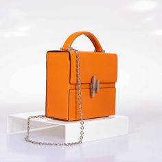 Introducing the Hermes Cinhetic Bag. The Cinhetic Bag was introduced in the brand’s Spring/Summer 2017 Collection, it was presented in the runway as a boxy shape with top handle. The bag features an asymmetrical H closure which comes in palladium plated or triple finishing plated. The boxy top handle includes a chain strap. Perfect cross body day into night. Love the roominess of this perfect everyday statement bag. Condition: Store FreshColor: AbricotMaterial: Mysore GoatHardware: PalladiumMeas Luxury Top Handle Box Bag For Gift, Luxury Structured Shoulder Bag With Dust Bag, Luxury Box Bag With Palladium Hardware, Luxury Top Handle Box Bag As Gift, Light Luxury Rectangular Box Bag For Formal Events, Luxury Box Bag With Silver-tone Hardware For Shopping, High-end Formal Box Bag With Dust Bag, Luxury Box Shoulder Bag With Silver-tone Hardware, Luxury Shoulder Box Bag With Silver-tone Hardware