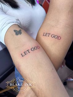 two people with tattoos that say let god and let go