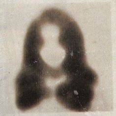 a black and white photo of a person's shadow