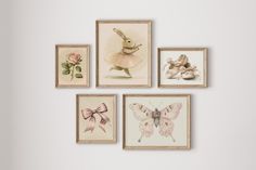 four framed pictures on the wall with flowers and ballet shoes in front of them,