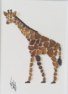 a giraffe made out of rocks on a white background with writing underneath it